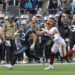 Carolina Panthers ball carrier breaks away from a Washington defender during an NFL game